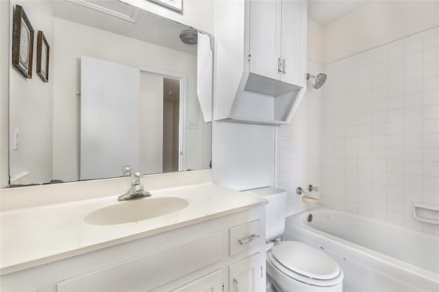 full bathroom featuring vanity, toilet, and tiled shower / bath combo