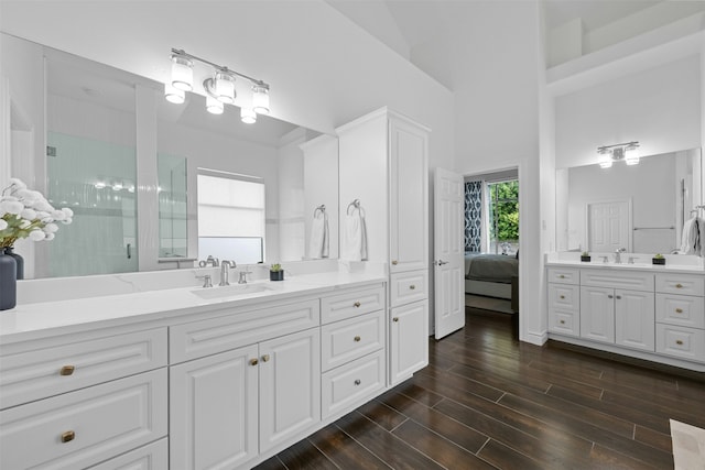 bathroom with vanity and a shower