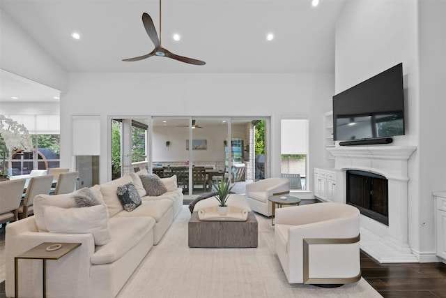 living room featuring ceiling fan and wood-type flooring