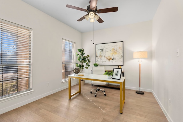 office area with light hardwood / wood-style floors and ceiling fan