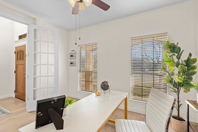 office space featuring ceiling fan and light wood-type flooring