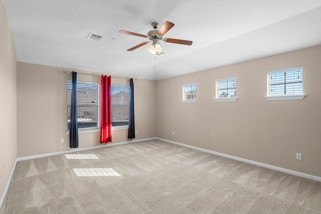 carpeted spare room with ceiling fan