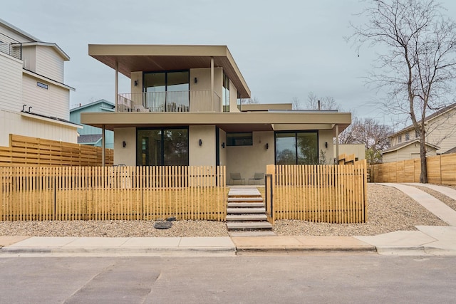 contemporary house featuring a balcony