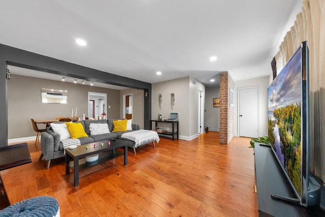 9009 N Plz Unit 118, Austin, TX 78753 - living area featuring light wood-style flooring, baseboards, and recessed lighting