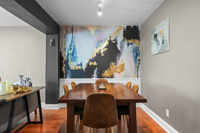 9009 N Plz Unit 118, Austin, TX 78753 - dining room with wood finished floors, an accent wall, and baseboards