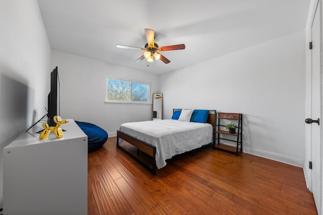 9009 N Plz Unit 118, Austin, TX 78753 - bedroom with hardwood / wood-style floors, baseboards, and a ceiling fan