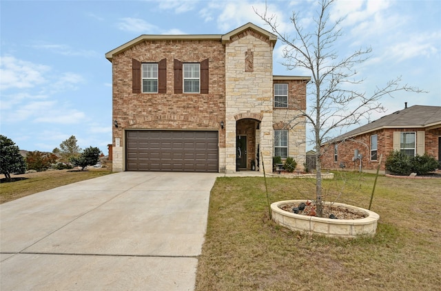 view of front of house with a garage and a front yard