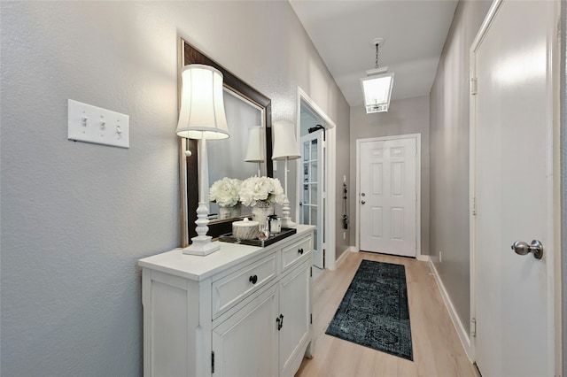 entryway with light hardwood / wood-style flooring