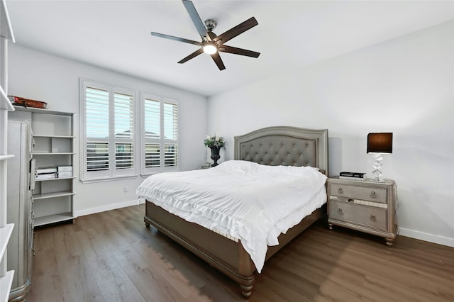 bedroom with dark wood-type flooring and ceiling fan