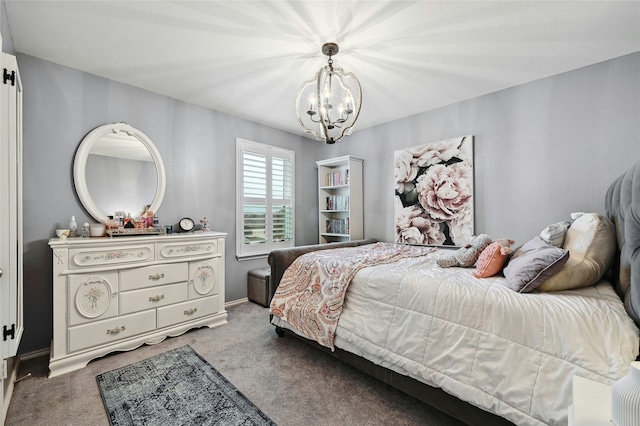 bedroom with a notable chandelier and carpet floors