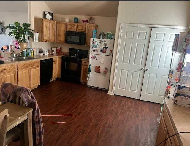 kitchen with sink, black appliances, and dark wood-type flooring