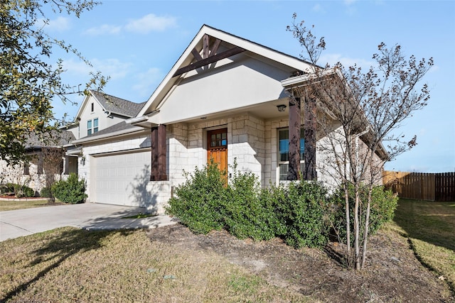 view of front facade with a garage and a front yard