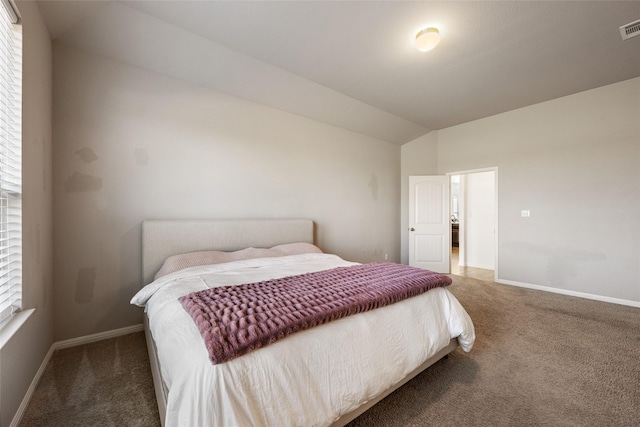 carpeted bedroom with vaulted ceiling