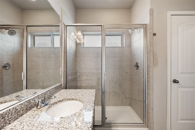 bathroom with vanity and an enclosed shower