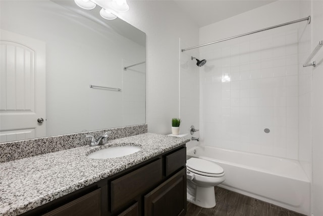 full bathroom with vanity, hardwood / wood-style flooring, toilet, and shower / bathing tub combination