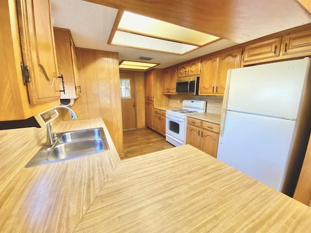 kitchen featuring sink and white appliances