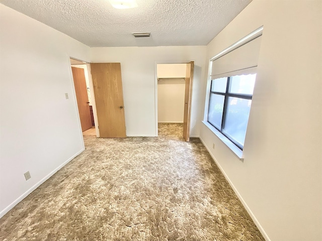 unfurnished bedroom featuring a closet and a textured ceiling