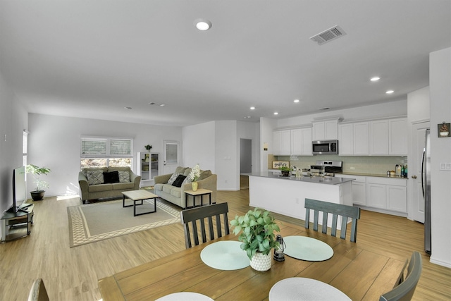 dining area featuring light hardwood / wood-style floors