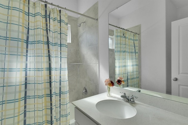 bathroom with vanity and shower / bath combo with shower curtain