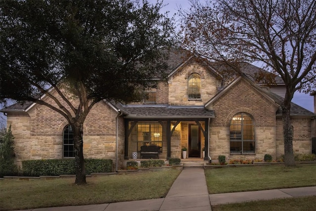 view of front of house with a yard