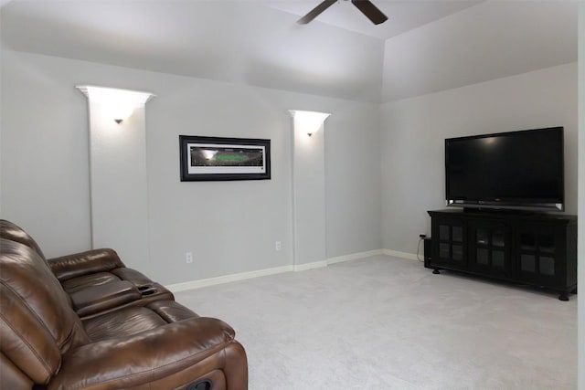 carpeted living room with ceiling fan