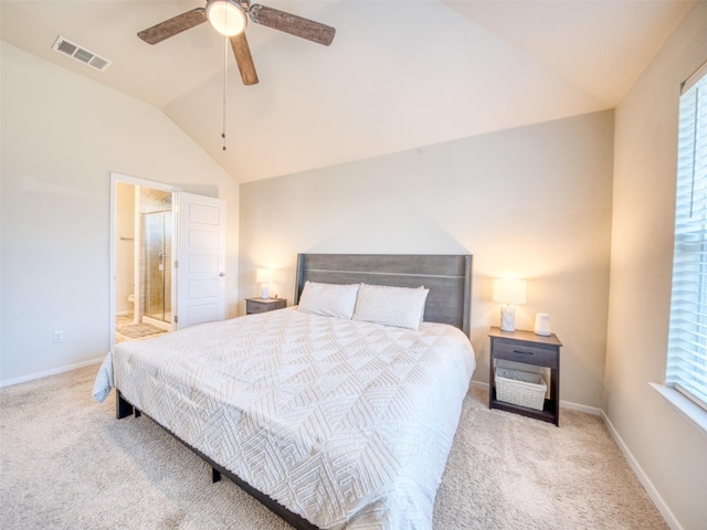 carpeted bedroom featuring ceiling fan, connected bathroom, and lofted ceiling