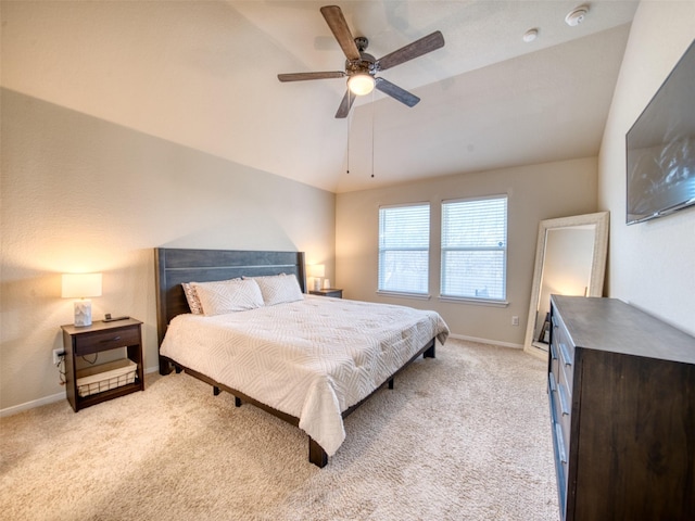 carpeted bedroom featuring ceiling fan and lofted ceiling