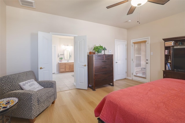 bedroom with light hardwood / wood-style flooring, connected bathroom, and ceiling fan