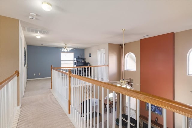 1201 Drake Cv, Leander, TX 78641 - hallway featuring light colored carpet, baseboards, and an upstairs landing