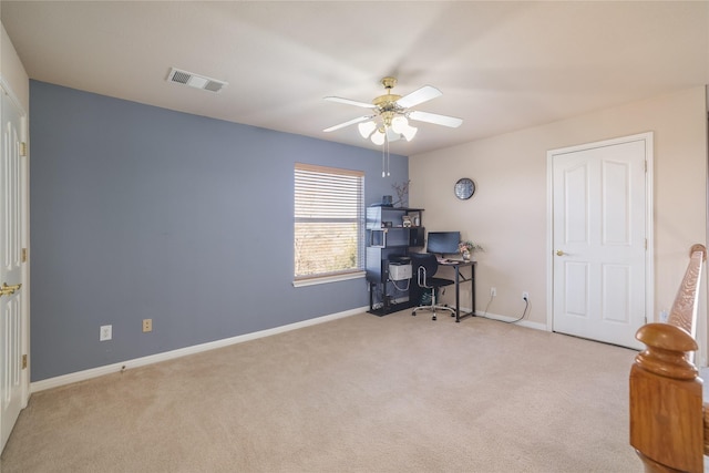 office area featuring ceiling fan and light carpet