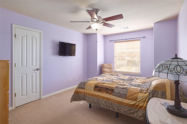 bedroom with light carpet and ceiling fan