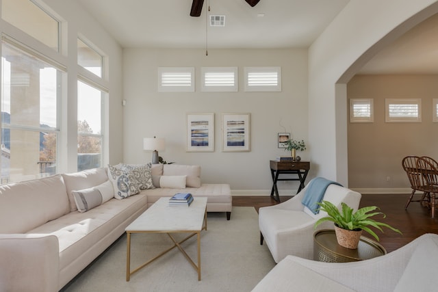 living room featuring hardwood / wood-style flooring and ceiling fan