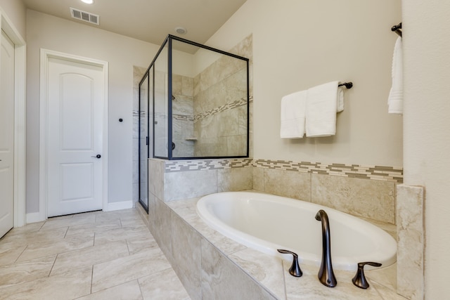 bathroom featuring separate shower and tub and tile patterned flooring