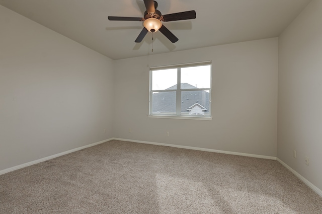 spare room with carpet flooring and ceiling fan