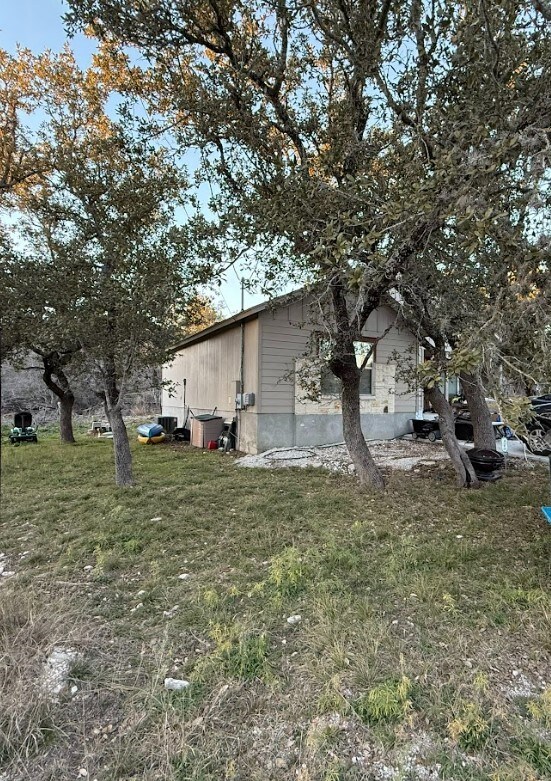 2421 Hornsby, Spring Branch, TX 78070 - view of home's exterior with a lawn