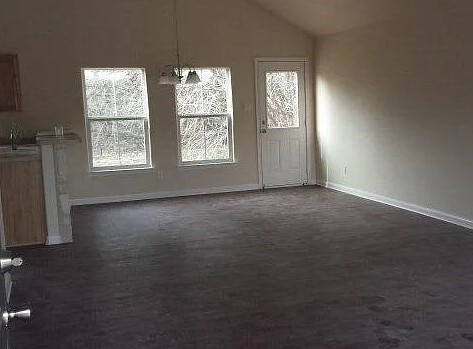 2421 Hornsby, Spring Branch, TX 78070 - unfurnished dining area featuring sink and lofted ceiling