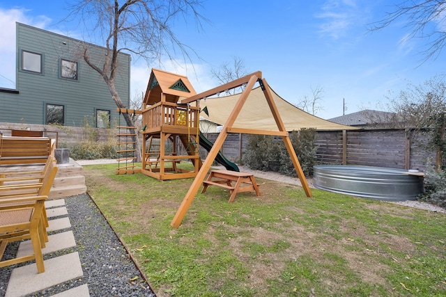 view of jungle gym featuring a lawn