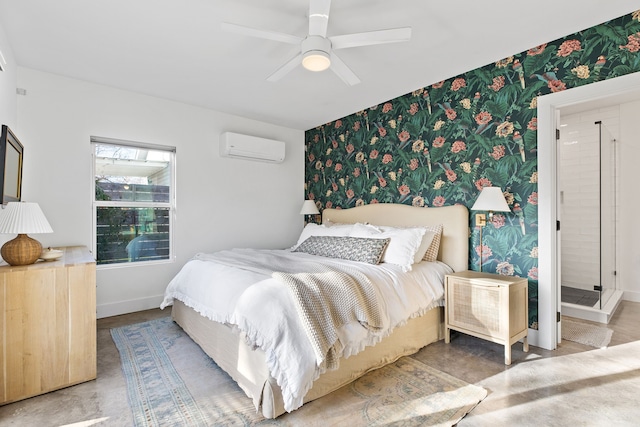 bedroom featuring ceiling fan, ensuite bathroom, concrete floors, and a wall mounted air conditioner