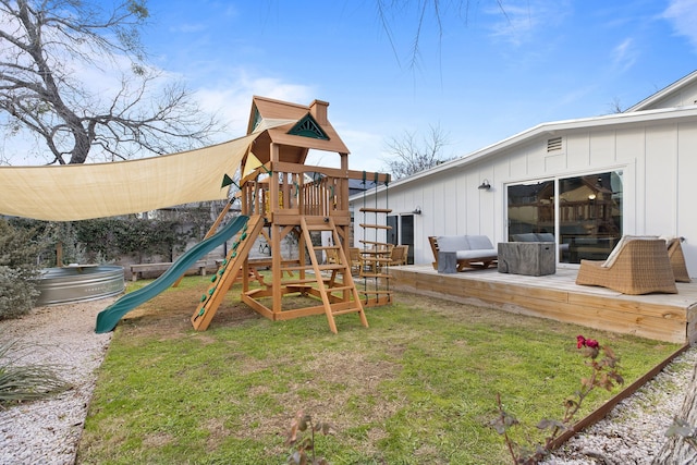 view of play area featuring a lawn and an outdoor hangout area