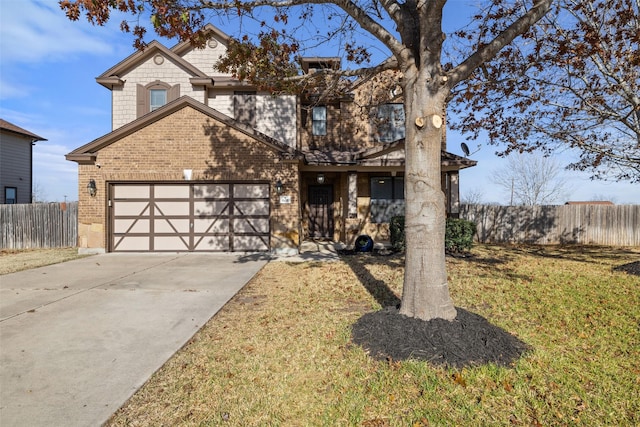 view of front of home featuring a garage and a front lawn