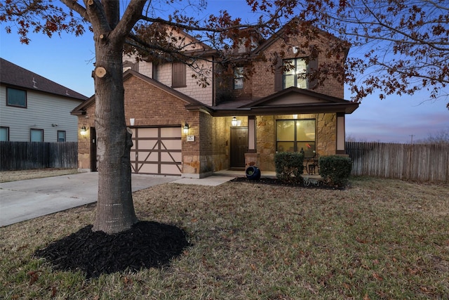 view of front of home featuring a lawn and a garage