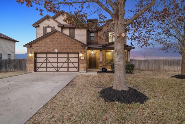 view of front facade with a lawn and a garage