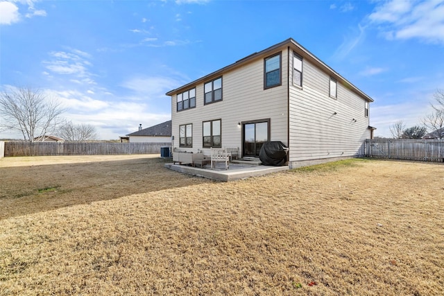 back of house with central AC unit, a yard, and a patio