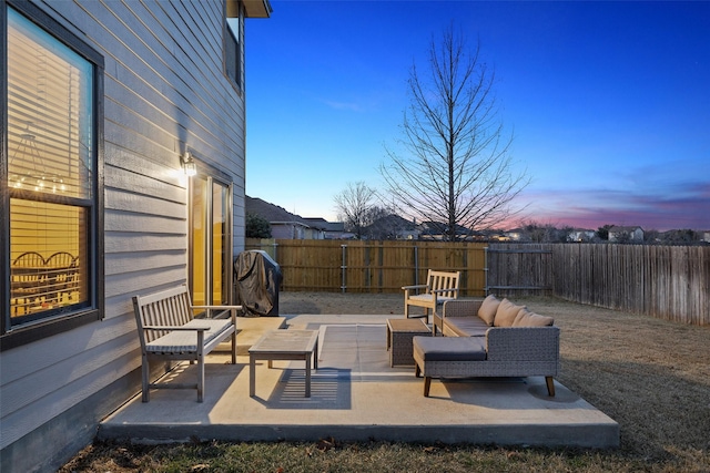 patio terrace at dusk with outdoor lounge area