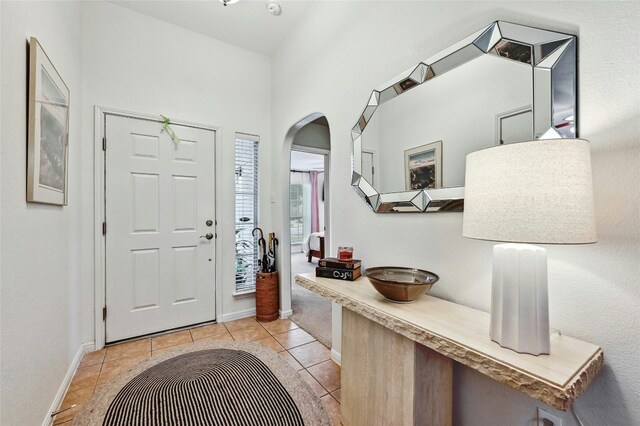 entrance foyer with light tile patterned floors