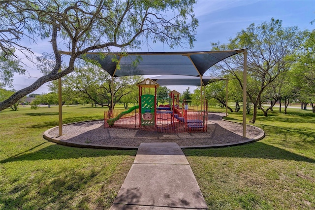 community playground featuring a lawn