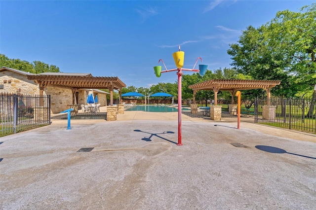 view of jungle gym featuring a fenced in pool, fence, a pergola, and a patio