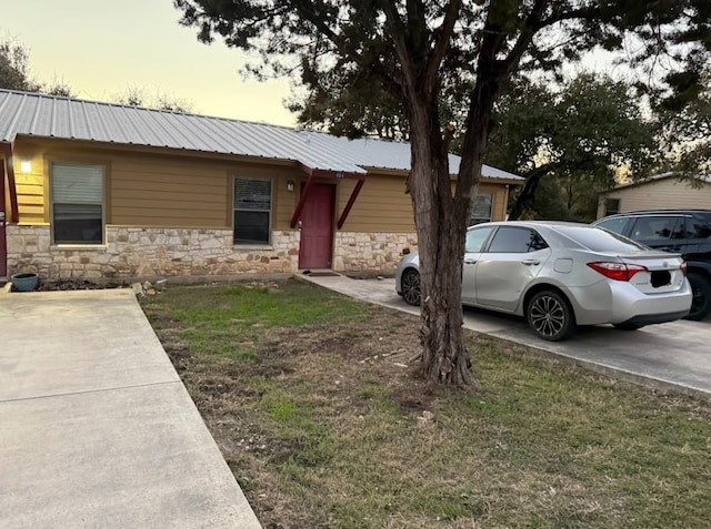 view of front of home with a yard