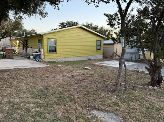 view of side of home featuring a patio area