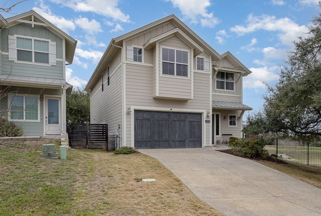 view of front of house featuring a garage and a front lawn